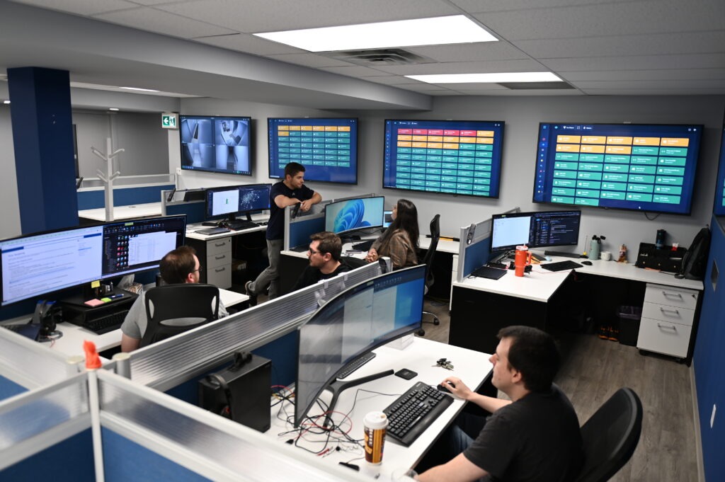 Enviromon / Netmon operations center with monitoring dashboards